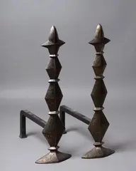 Cox London, A pair of contemporary cast bronze firedogs, sculpted in the Post-War manner, with forged iron returns, warm bronze finish