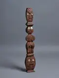 Carving by New Zealand Folk Art, on a Māori theme featuring a central Tekoteko figure atop a koruru face and a manaia head to the top section, sold Nov 2021