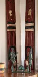 An impressive pair of Amo boards by Ngāpuhi tribal region, carved with male and female warrior figures wearing piupiu. The female figures each holding a patu and the male figures , sold Nov 2021