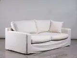 New Zealand made, Two-seater sofa, with cream linen loose covering, wooden frame