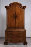 Thieren Studio Workshops, Walnut two door cabinet, over three drawers with inlaid starburst decoration and scroll feet