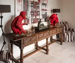 Usa Formations, A very decorative heavily carved walnut four-draw serving table, with stretchered base on six legs