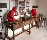 Usa Formations, A very decorative heavily carved walnut four-draw serving table, with stretchered base on six legs