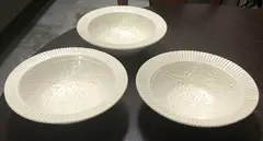 Warren Randall, Three white ceramic bowls, with impressed abstract decoration