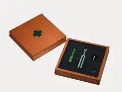 Joe Sheehan, Survival Kit, Russian nephrite jade, pounamu from Big Bay, South Australian black nephrite jade in wooden case, edition of 10 (2006)
