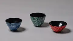 Lyndsay Patterson, Set of three Murrine style bowls, blown glass in black with blue, red and green overlay