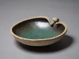 Len Castle, Avian Bowl, the interior with crackled dark green and dark grey glazes, umber pigment rubbed exterior
