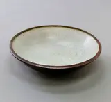Doreen Blumhardt, Large shallow bowl, stoneware with speckled matted grey glaze to the interior, tenmoku to the exterior
