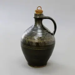 Mirek Smisek, Wine flagon, stoneware ribbed body with dark grey glaze and wax-resist decoration, original cane stopper