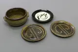 Selection of tableware by New Zealand Pottery, glazed stoneware, comprising a pair of plates by Warwick Lidgard, a Peter Oxborough casserole and an unmarked plate, sold Dec 2020