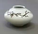Contemporary Korean Studio Pottery, Large squat vase attributed to Shin Sang-Ho, porcelain painted with a flowering prunus branch beneath a very pale celadon glaze