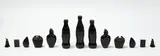 Sriwhana Spong, Lac Pieces 23 – 35, Masonite, lac, black pigment, Coke bottles, 13 parts