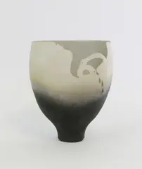 Debbie Pointon, Raku fired vase, with shaped and pierced side