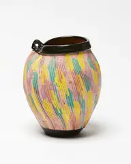 Earthenware vase by Warren Tippett, with a band of multicoloured combed decoration, sold Sep 2019
