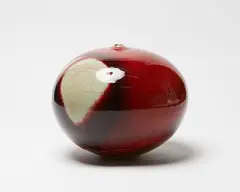 Campbell Hegan, Large globular vase, stoneware with rich and thick sang de boeuf glaze thinning to a light mushroom tone at a large strawberry-shaped area on the shoulders