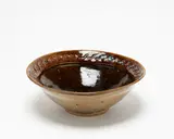 Barry Brickell, Large bowl, ash glazed stoneware, the upper rim with jun glaze splashes over interlaced relief pattern