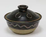 Barry Brickell, Lidded casserole dish, stoneware, wax resist abstract decoration on tenmoku glaze