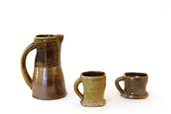 Ross Mitchell-Anyon, Woodfired stoneware jug, and two mugs, all with olive and brown glazes