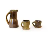Ross Mitchell-Anyon, Woodfired stoneware jug, and two mugs, all with olive and brown glazes
