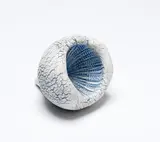 Sea Secret by Len Castle, earthenware cone shaped with textured surface and blue pigment, sold Jun 2019