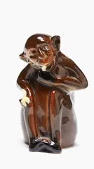 Crown Lynn, Monkey eating a banana, glazed ceramic