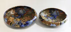 Frederick Rhead, Two Bursley Ware Amstel platters, painted ceramic with bird decoration