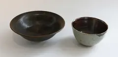 Stoneware bowl by Graeme Storm, together with a Adrian Cotter bowl, offered Jun 2019