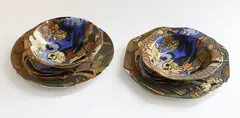 Frederick Rhead, Four Bursley Ware Amstel dishes, of different shapes