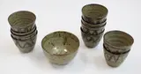 A set of ten cups and one small bowl by New Zealand Pottery, stoneware, sold Feb 2019