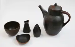 Pat Perrin, Stoneware coffee set, including a coffee pot, a cup and a milk jug, all marked; together with a similar unmarked pepper shaker and a small dish