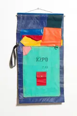 N.Z. P.O.C.K.E.T. by Donald Sinclair Driver, steel rod, buckle and found vinyl affixed on unstretched canvas, sold May 2018