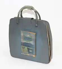 et al., Typewriter bag with Maatstaf publication attached, mixed media