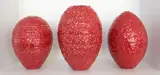 John Parker, Three red glazed bottle vases, of graduated size glazed ceramic