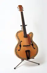 Michael Parekōwhai, Tua Rima from Patriot: Ten Guitars, flame maple, spruce, rewarewa, swamp kauri, ebony, paua shell and stand, 1999