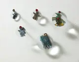 Peter Decker, Give and Take Series, carved Masonite, acrylic paint, aluminium, lazertran, magnifying glass, crushed bullet cases and nails