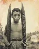Maori Boy with Caeved Paddles by Theodorus Johannes Schoon, large-scale vintage gelatin silver print, sold Jun 2017