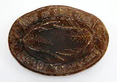 Woodnorth, brown glazed pottery bread plate, some small chips
