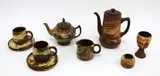 T. N Lovatt for Temuka pottery, Agateware part tea and coffee set, comprising coffee pot, tea pot, chalice, milk jug, two cups and four saucers. Together with a miniature vase