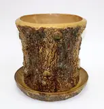 and matching dish by An early Nz pottery tree stump form planter, sold Sep 2016