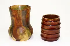 Two small vases by Briar Gardner, one in red and one in daubed brown and blue, sold Sep 2016