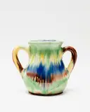 Jova Rancich, Two handled vase, with a rich majolica type glaze in blue, green, brown and yellow