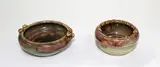 Briar Gardner, Two pottery dishes decorated, with berries in relief in brown and green glaze