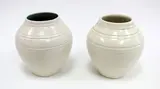 O.C Stephens, A pair of white glazed ovoid vases