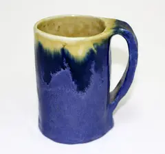 C. London, Pottery mug in blue and yellow glaze