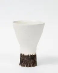 Early vase by Hans Coper, with buffed incised and textured foot with flaring conical upper section with white tin glaze (minor restoration to the , sold Sep 2016