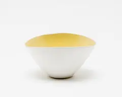 White tin glazed bowl by Lucie Rie, with yellow glazed interior (hairline crack), sold Sep 2016