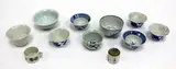 probably Song dynasty and later by A collection of ten Chinese wine cups, comprising two cups with monochrome white glaze, seven with blue and white decoration, and a famille rose one; together , sold Sep 2016