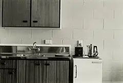 Gordon H. Brown, Motel Unit 2, Dunedin, September 1987: kitchen - benchtop, fridge, gelatin silver print