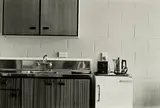 Gordon H. Brown, Motel Unit 2, Dunedin, September 1987: kitchen - benchtop, fridge, gelatin silver print