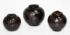 Three stoneware lidded vases by Graeme Storm, with floral decoration, sold Mar 2015